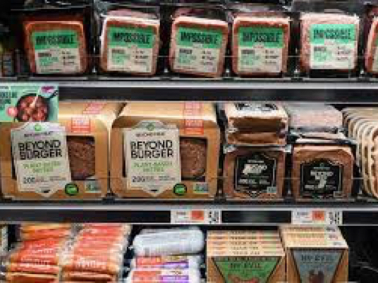 Photo of refrigerated alt-meats in the meat case at retail