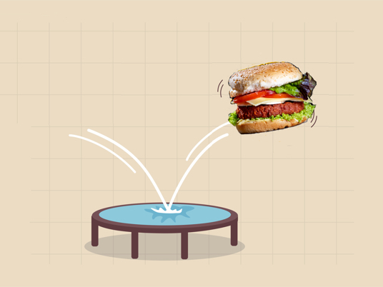 picture of an alt-meat burger bouncing off of a trampoline