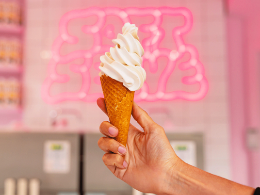 Oatly soft serve vanilla ice cream in a cone